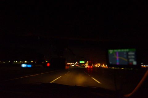 2003 Ford Taurus - Driving at night on a highway with a GPS unit visible on the dashboard.
