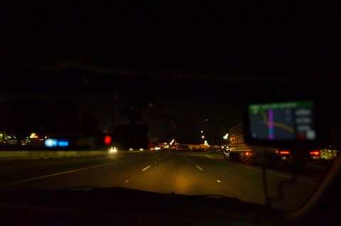 2003 Ford Taurus - Driving on a highway at night, with a GPS unit mounted on the dashboard.