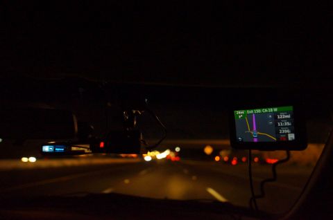 2003 Ford Taurus - Driving at night with GPS and radar detector visible on the dashboard.