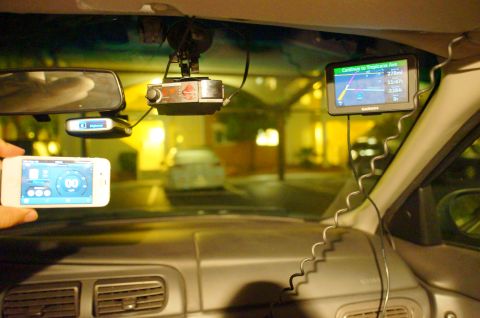 2003 Ford Taurus - Car interior shows a Garmin GPS, radar detector, and iPhone with a gauge app visible.
