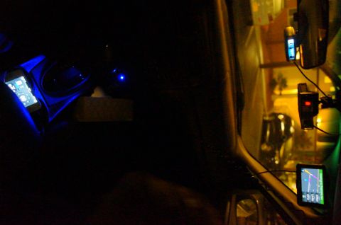 2003 Ford Taurus - Nighttime view inside a car, a phone mount with blue illumination and a GPS navigation system.