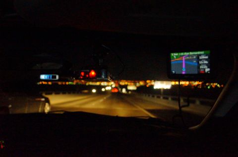 2003 Ford Taurus - Driving at night with a GPS navigation system and a radar detector visible inside the vehicle.