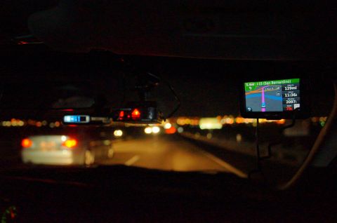 2003 Ford Taurus - Driving at night on the highway, a GPS displays the route to San Bernardino while a radar detector is mounted on the windshield.