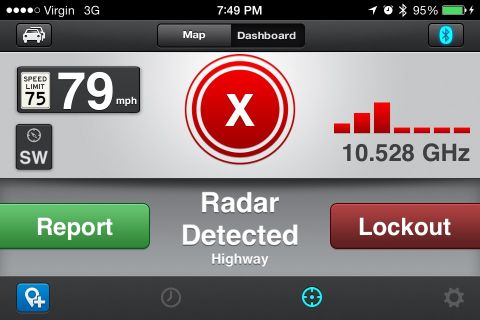 2003 Ford Taurus - A smartphone screen displays a radar detector app with speed and radar information.