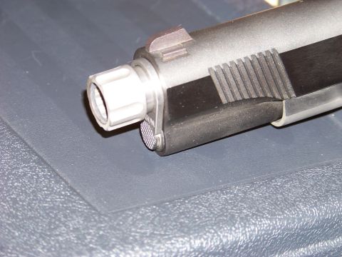 1995 Mercury Grand Marquis - Close-up view of a firearm's barrel, showing intricate details of its construction.
