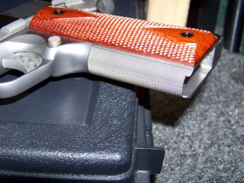 1995 Mercury Grand Marquis - Close-up of a pistol grip with wood panels and textured metal.