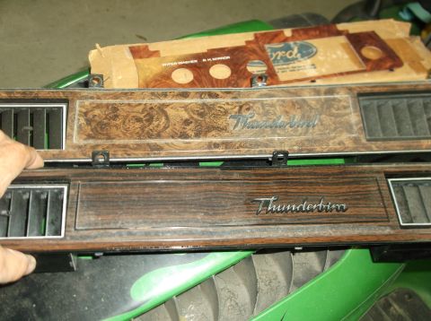 1979 Ford Ranchero - Two dashboard trim panels, one with a Ford logo box, are shown up close.