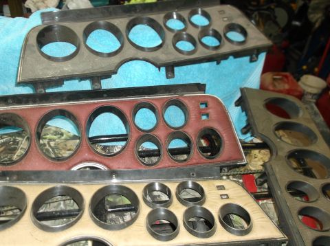 1979 Ford Ranchero - Multiple automotive instrument clusters are shown, some with red padding and others with a wood-grain appearance.