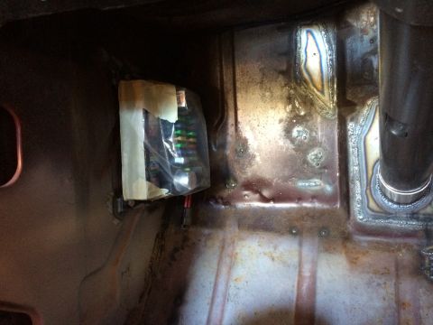 1964 Ford Fairlane - Close-up of a custom-installed fuse box with wiring, attached to a metal surface.