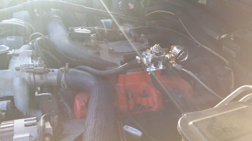 Regulator assembly mounted. Simple bracket made out of 16 gauge steel (I think.) Seems fairly sturdy; I figure if I can not bend it by hand then it should survive under the hood. At least that is what I am hoping.