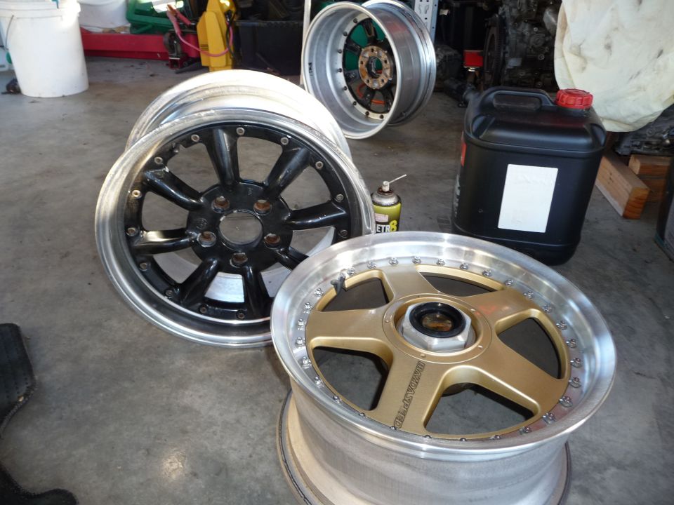 Gold five-spoke wheel with 'MAZDASPEED' text