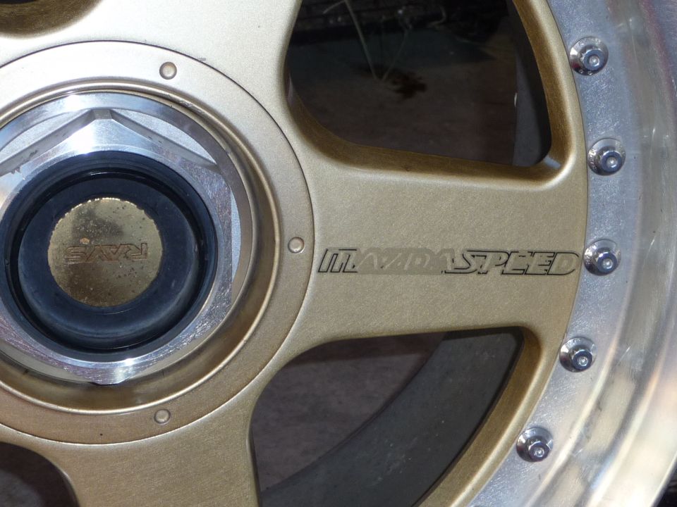 Gold Mazdaspeed wheel with RAYS center cap