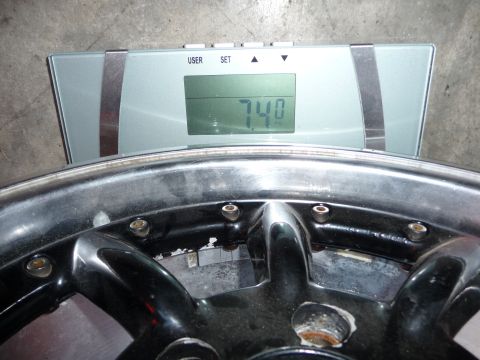 1993 Mazda MX-3 - Wheel weight measured at 7.4 kg on a digital scale.