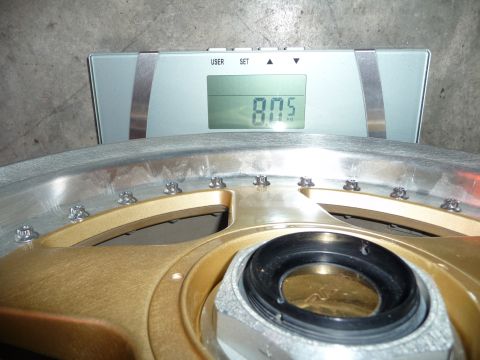 1993 Mazda MX-3 - A close-up of a wheel being weighed on a digital scale.
