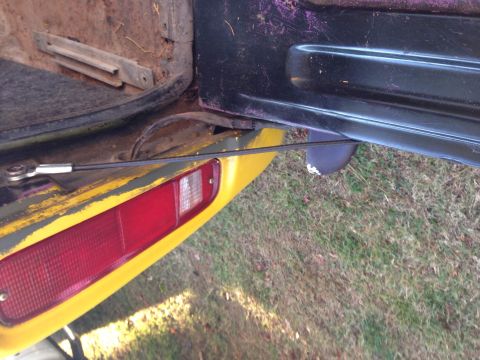 1979 Ford Bronco - Close-up of the 1979 Ford Bronco's tailgate interior and rear taillight assembly.