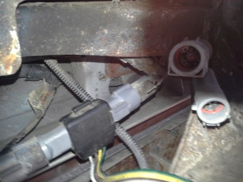 1991 Ford F-250 - Close-up of trailer hitch wiring connectors, showing electrical connections.
