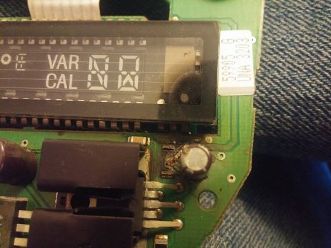 2000 Mercury Grand Marquis - A digital display with text and numbers is shown on a circuit board, likely part of a vehicle's electronics.