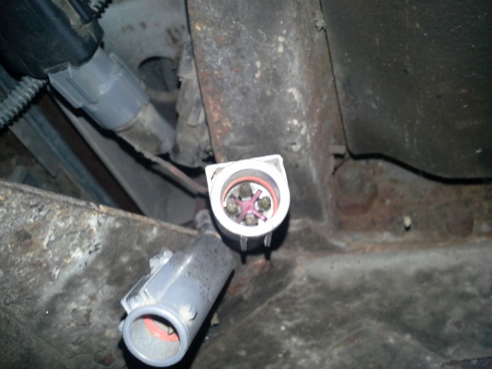 Close-up of a vehicle's electrical connector and wiring harness