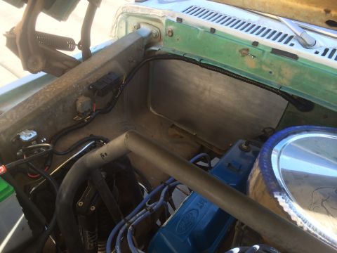 1977 Ford F-350 - Close-up view of the engine bay wiring and components in a 1977 Ford F-350 truck.