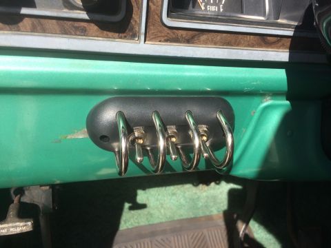 1977 Ford F-350 - Auxiliary switches installed on the dashboard of a vehicle.