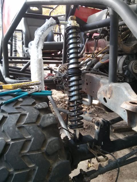 1986 Ford Bronco - Close-up of an off-road vehicle's suspension system and chassis components.