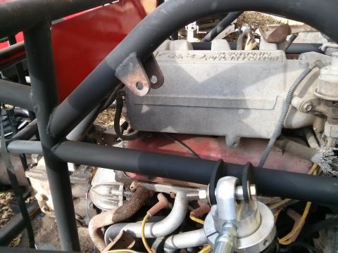 1986 Ford Bronco - Close-up view of an engine bay with a prominent roll cage structure and a "SUPERMOTORS.NET" watermark.