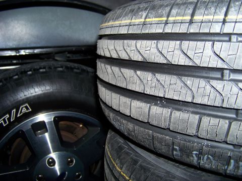 1999 Mercury Grand Marquis - A stack of tires is visible, with one tire showing a silver rim and BFGoodrich branding.