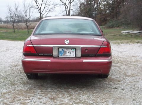 1999 Mercury Grand Marquis - Rear view of a red 1999 Mercury Grand Marquis sedan with Indiana license plate UTM573.