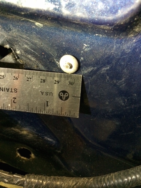1990 Ford F-150 - A close-up view of a blue metal panel shows a white plastic clip and a ruler for scale.