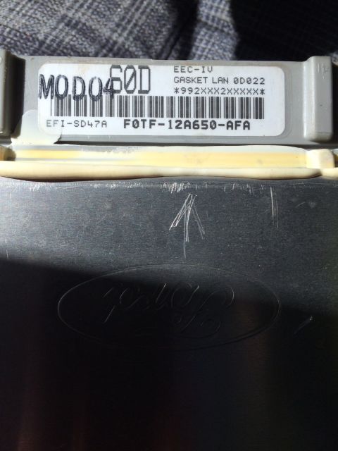 1990 Ford F-150 - Close-up of a Ford EEC-IV engine control module, part number F0TF-12A650-AFA.