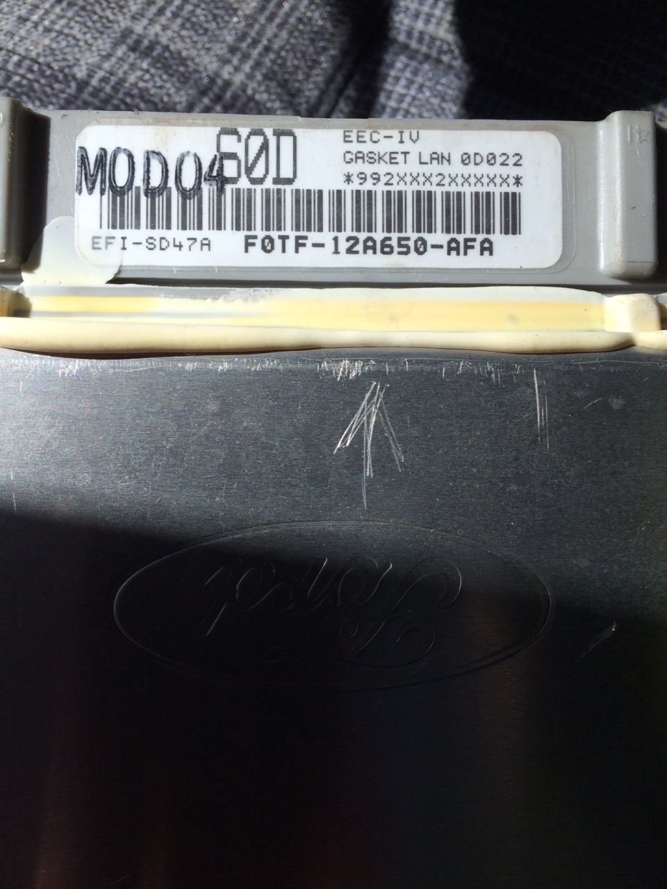 Ford EEC-IV ECU module with barcode label F0TF-12A650-AFA and embossed Ford oval