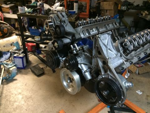 1996 Ford Bronco - Ford V8 engine assembly with various components mounted, likely undergoing repair or rebuild.