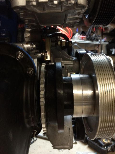 1996 Ford Bronco - This image shows a close-up view of an engine's pulley system and associated components.