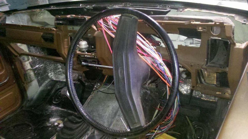 1982 Ford Bronco interior showing dashboard disassembly and exposed wiring harness