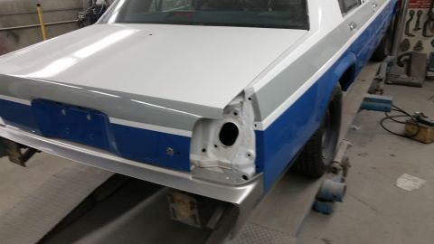 1991 Ford LTD Crown Victoria - Rear view of a 1991 Ford Crown Victoria LTD undergoing repairs in a shop.