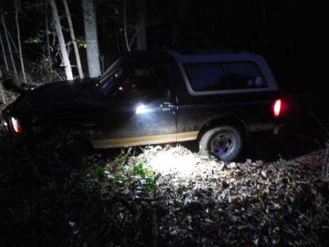 1983 Ford Bronco - Trailblazing on my property, momentarily unable to go forward. I winched a foot or 2 and drove out.