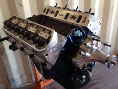 1996 Ford Bronco - Engine part shown on a stand, with visible text on the block and a watermark.
