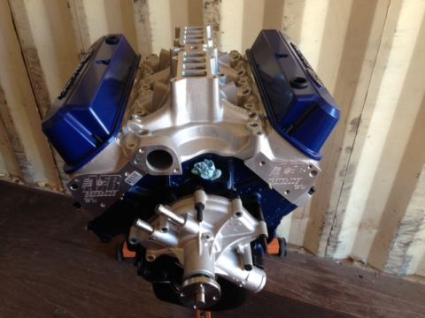 1996 Ford Bronco - A V8 engine with blue valve covers and an aluminum intake manifold is shown, possibly for a custom build.