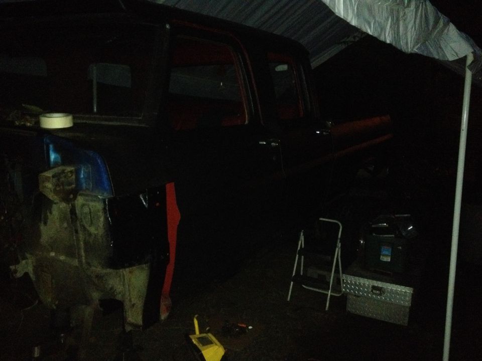 1971 Ford F-250, dark paint, undergoing repairs