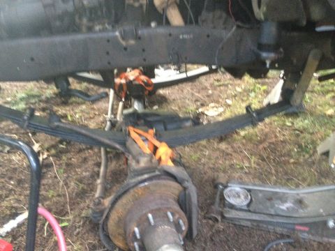 1971 Ford F-250 - Underside view of a truck chassis, showing suspension components and a brake rotor, with the Supermotors.net logo at the bottom.