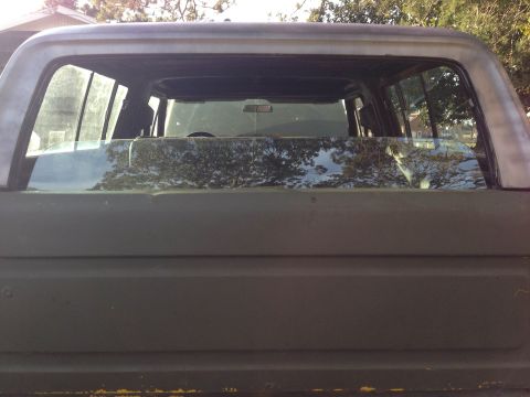 1979 Ford Bronco - Rear view of an SUV, showing the window and roofline.