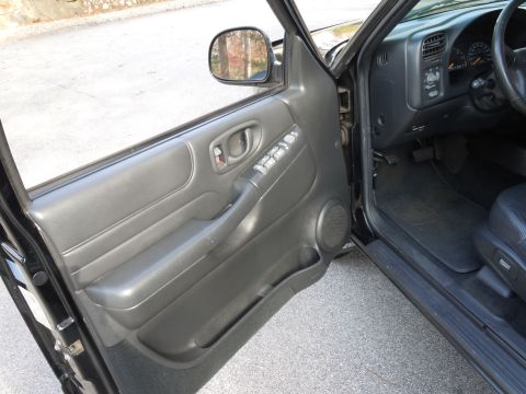 2001 Ford Crown Victoria - Interior view of a black vehicle's driver side, revealing the door panel and dashboard details.