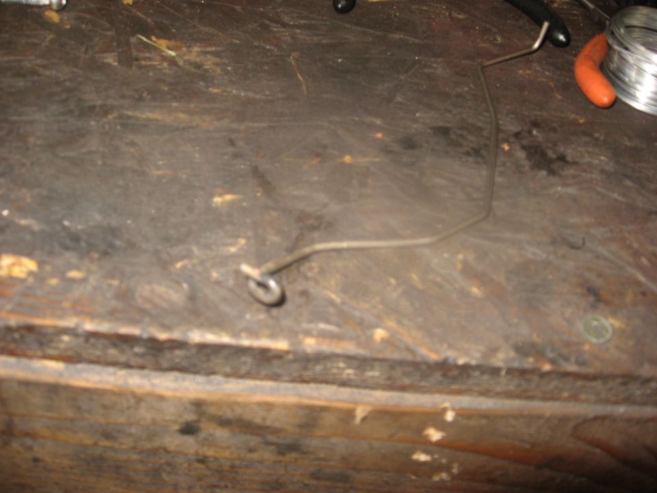 Metal rod with a loop on a workbench