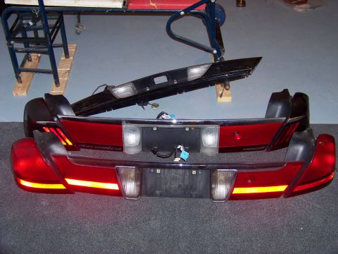 1999 Mercury Grand Marquis - Two rear bumper and tail light assemblies are shown, one above the other, with wiring visible.