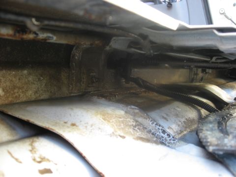 1994 Ford Bronco - Engine bay wiring and frame detail, showing signs of wear and dirt.