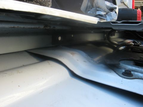 1994 Ford Bronco - The interior structure of a vehicle is visible, showing metal panels and wiring.