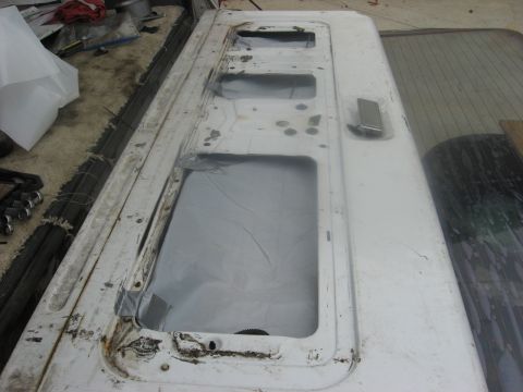 1994 Ford Bronco - This is a close-up view of a vehicle's tailgate, showing its construction and window openings.
