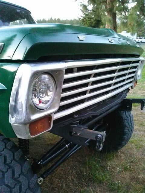 1967 Ford F-250 - Front view of a green 1967 Ford F-250 pickup truck with a chrome grille and off-road suspension.
