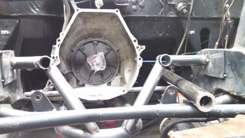 1967 Ford F-250 - Close-up view of a vehicle's transmission housing and custom fabricated frame elements.