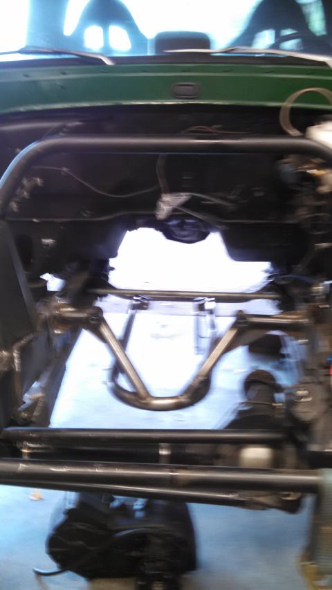 1967 Ford F-250 - Close-up view of custom suspension parts installed on a vehicle.